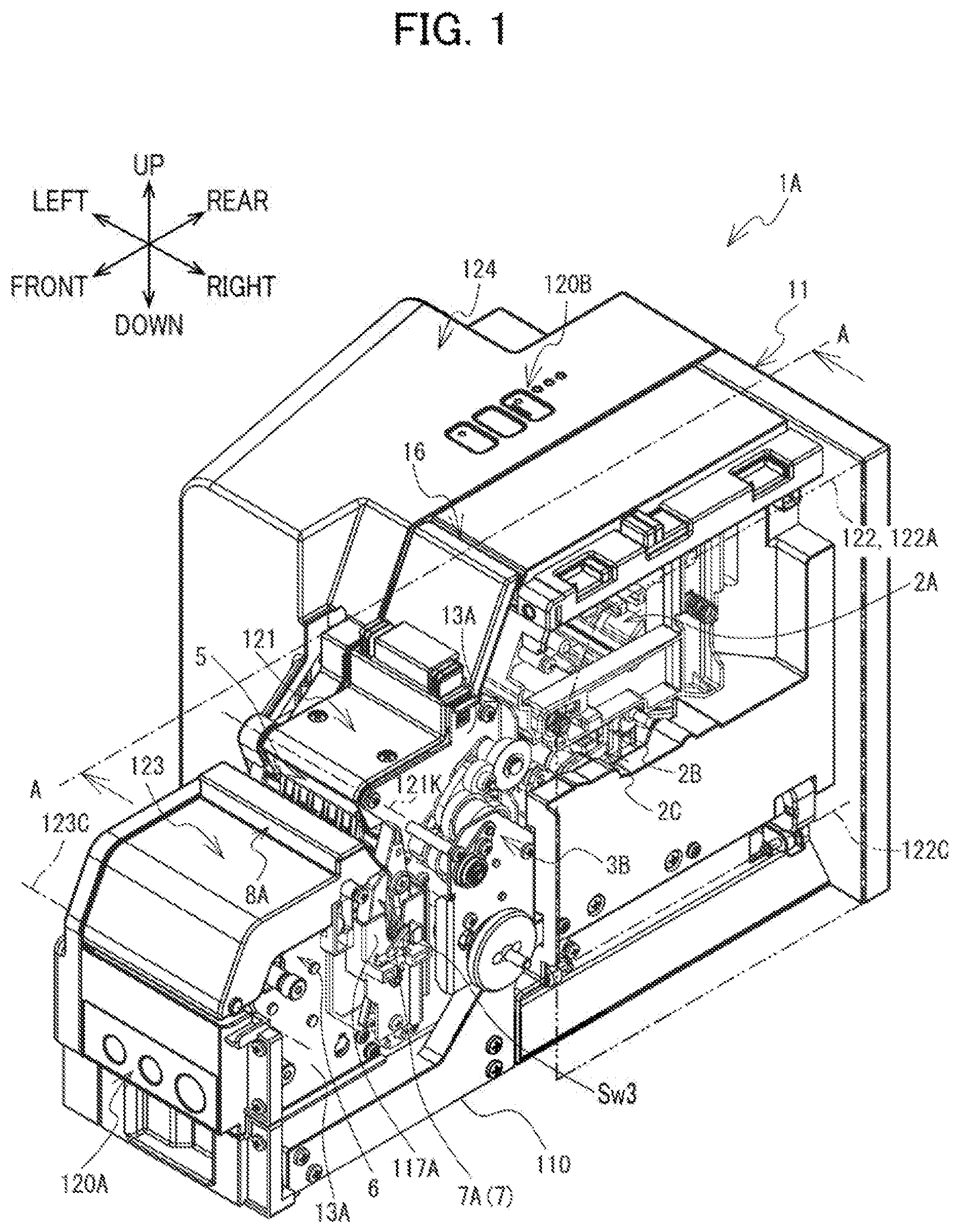 Patent US12617575 — Label affixing device including peeling part peeling label off release material, affixing part affixing label to adherend, and discharge part through which release material is discharged — Figure 1